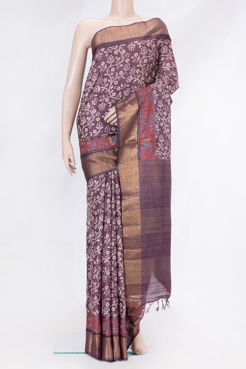 Purple Tussar Silk Saree with Printed design on the body and Embroidery Border.  displayed on a mannequin