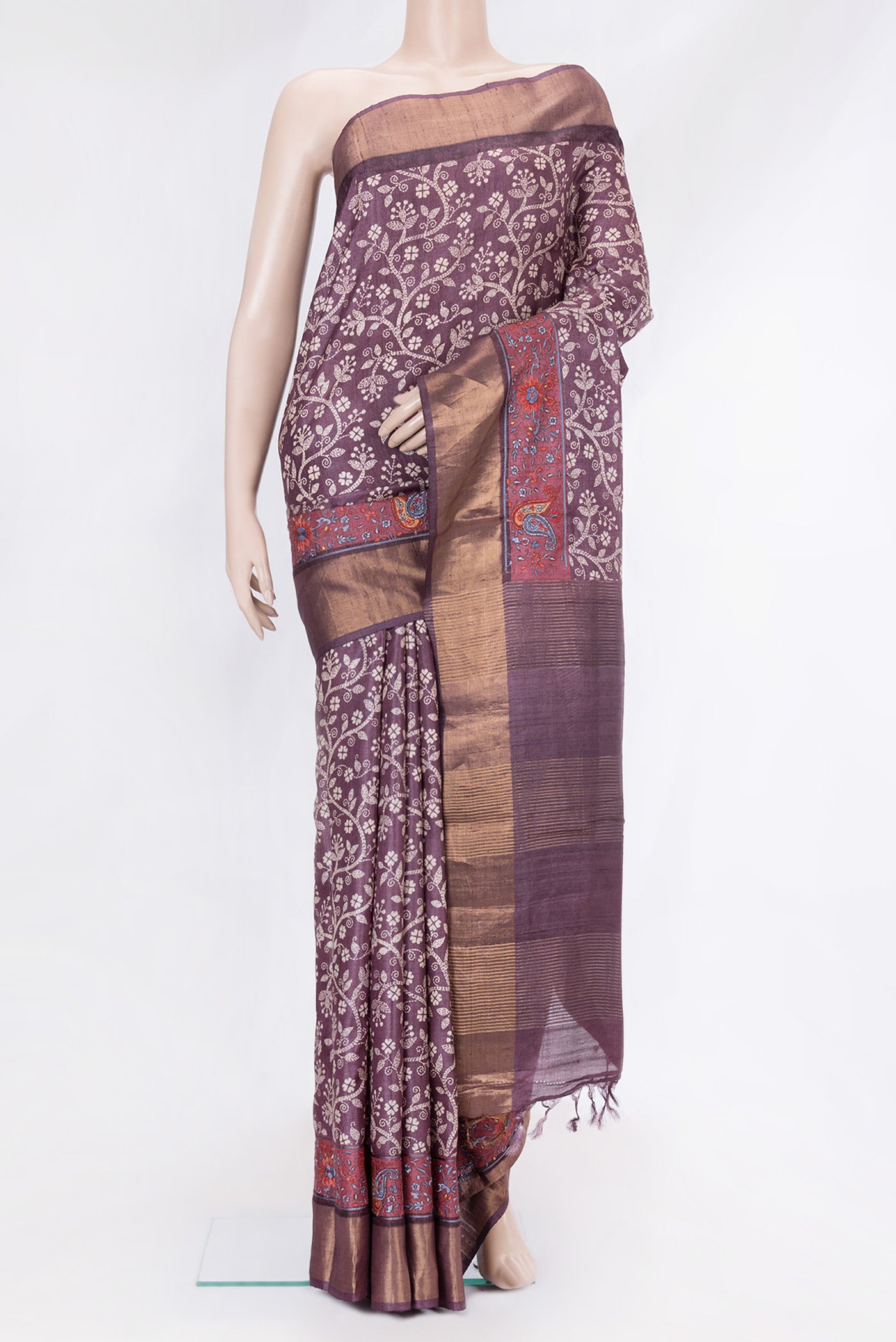 Purple Tussar Silk Saree with Printed design on the body and Embroidery Border.  displayed on a mannequin