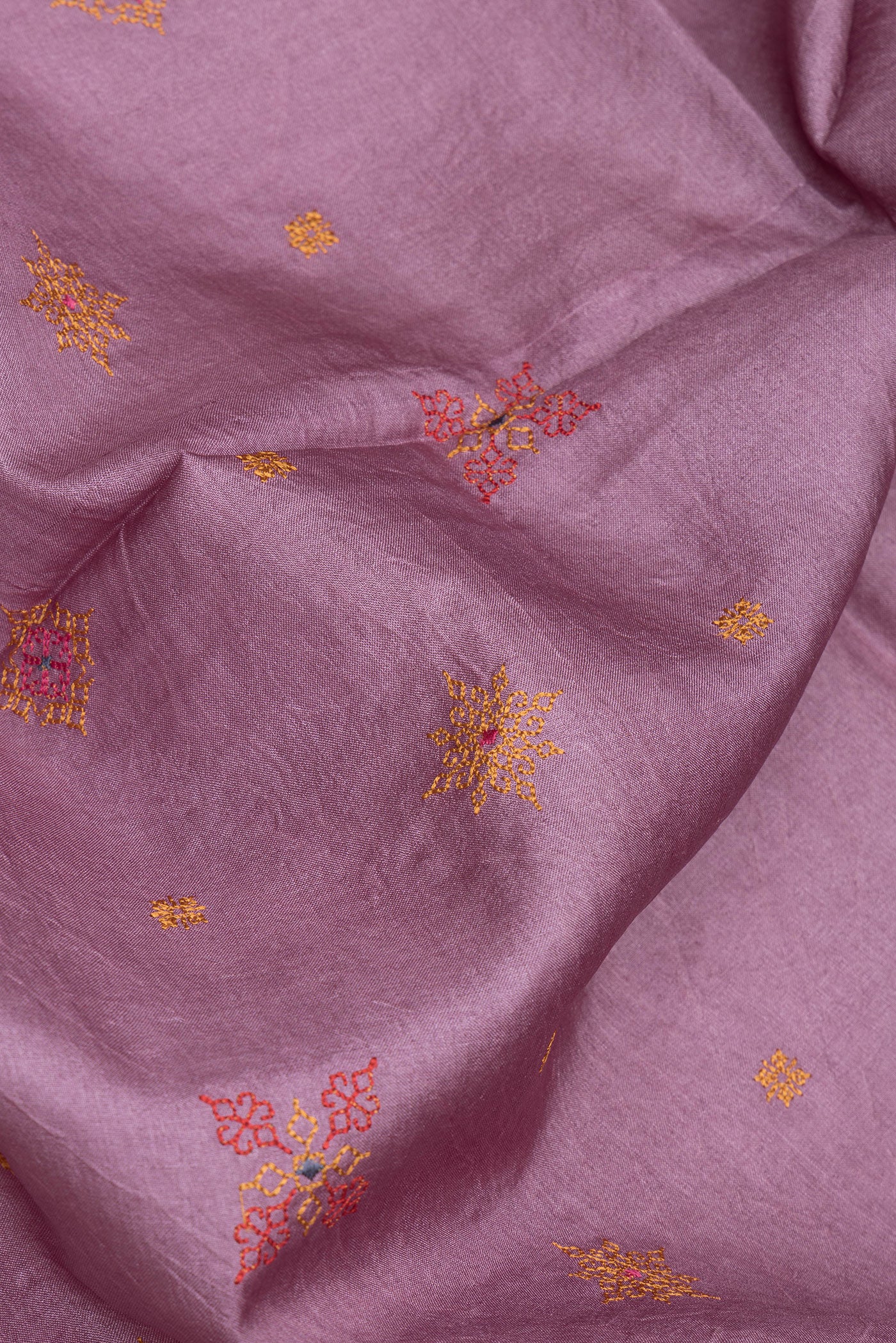 Close up of Pink Dual Tone Tussar Silk Saree with Embroidery on the body and Printed Border.  displaying folds