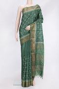 Green Dual Tone Tussar Silk Saree with Embroidery on the body and Zari Border.  displayed on a mannequin