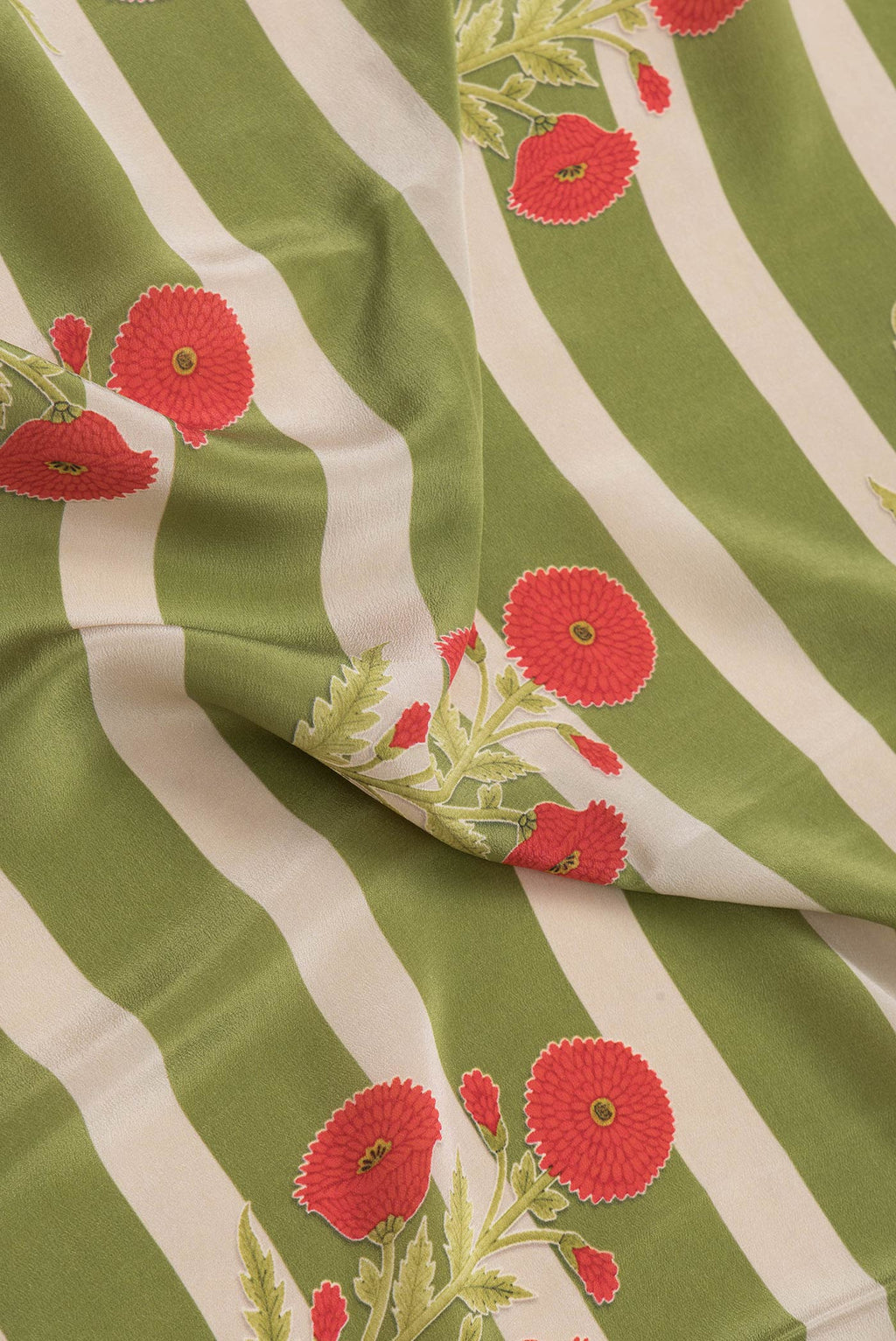 Close up of Green Dual Tone Mysore Crepe Saree with Printed design on the body and Without Border.  displaying folds