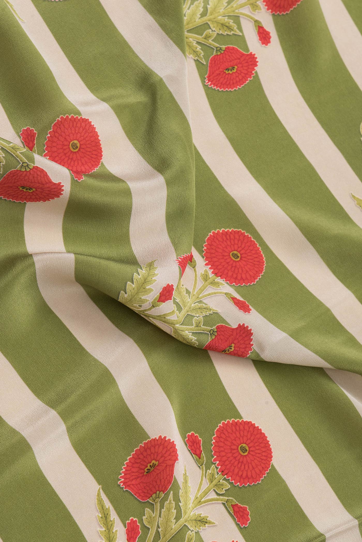 Close up of Green Dual Tone Mysore Crepe Saree with Printed design on the body and Without Border.  displaying folds