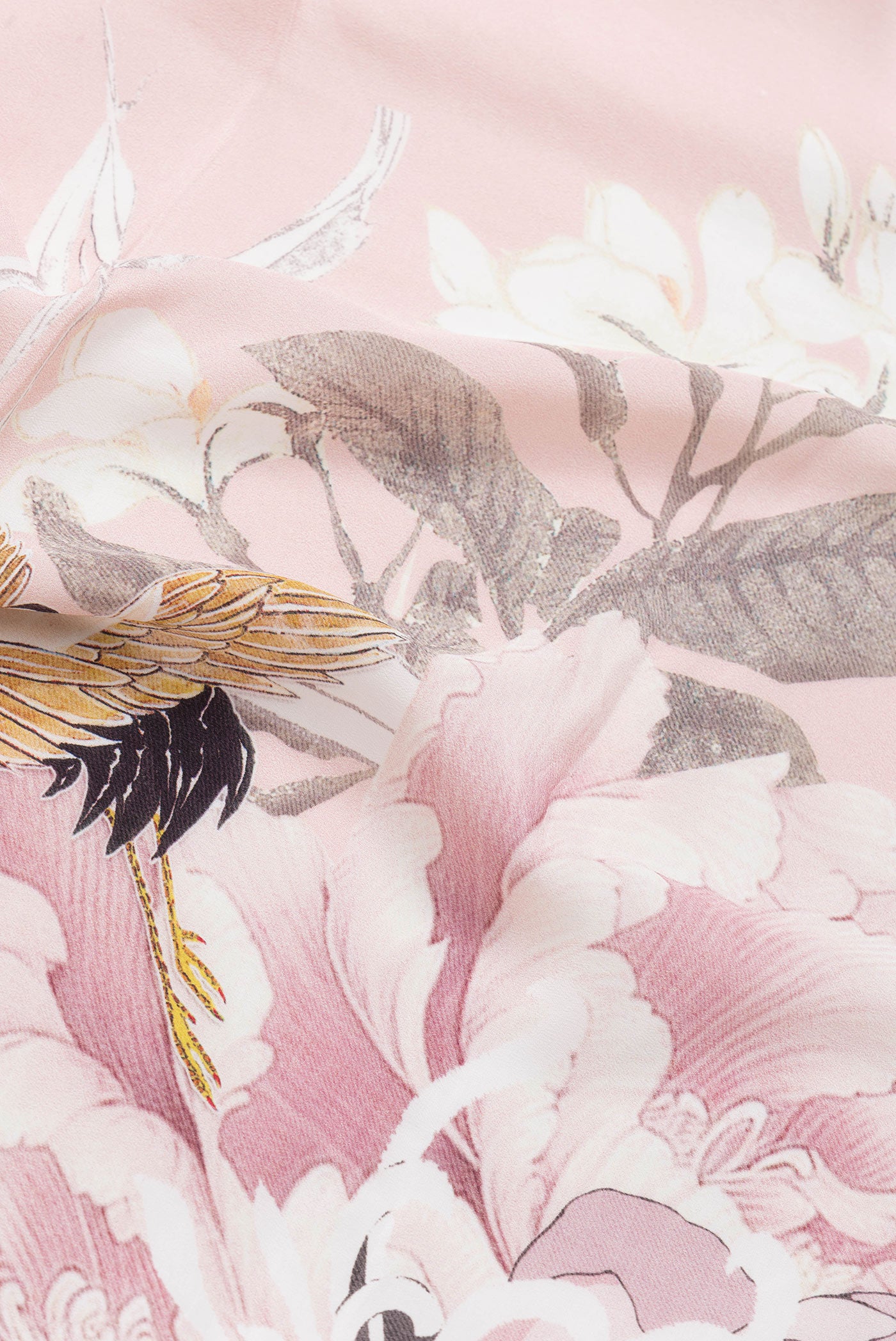 Close up of Rose Gold Dual Tone Mysore Crepe Saree with Printed design on the body and Without Border.  displaying folds