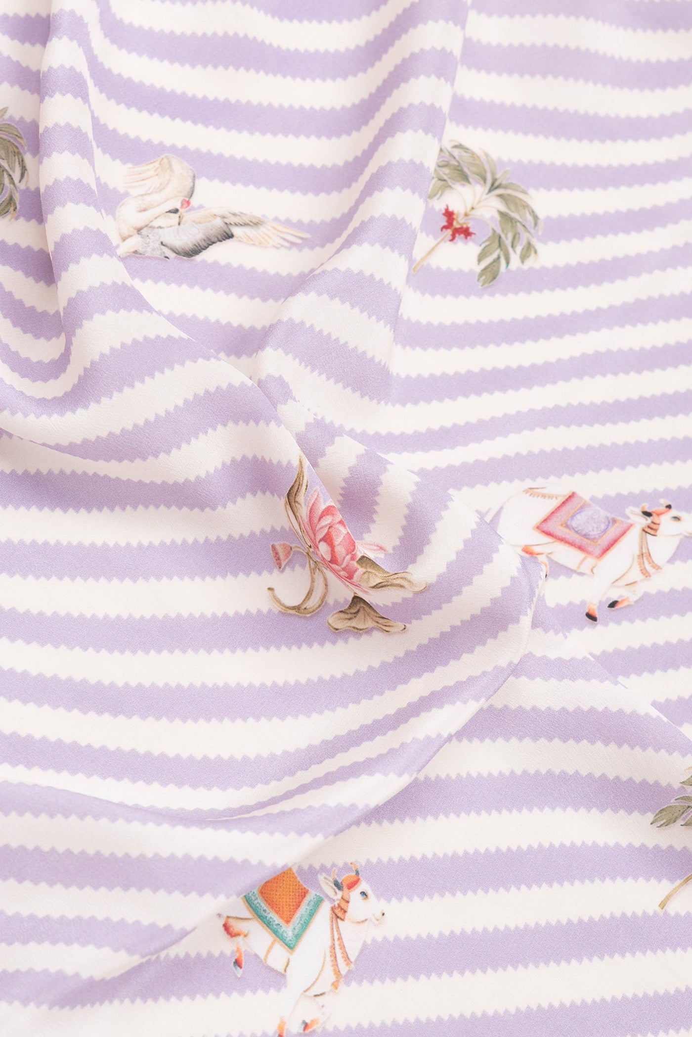 Close up of Lavender Mysore Crepe Saree with Printed design on the body and Plain Border.  displaying folds