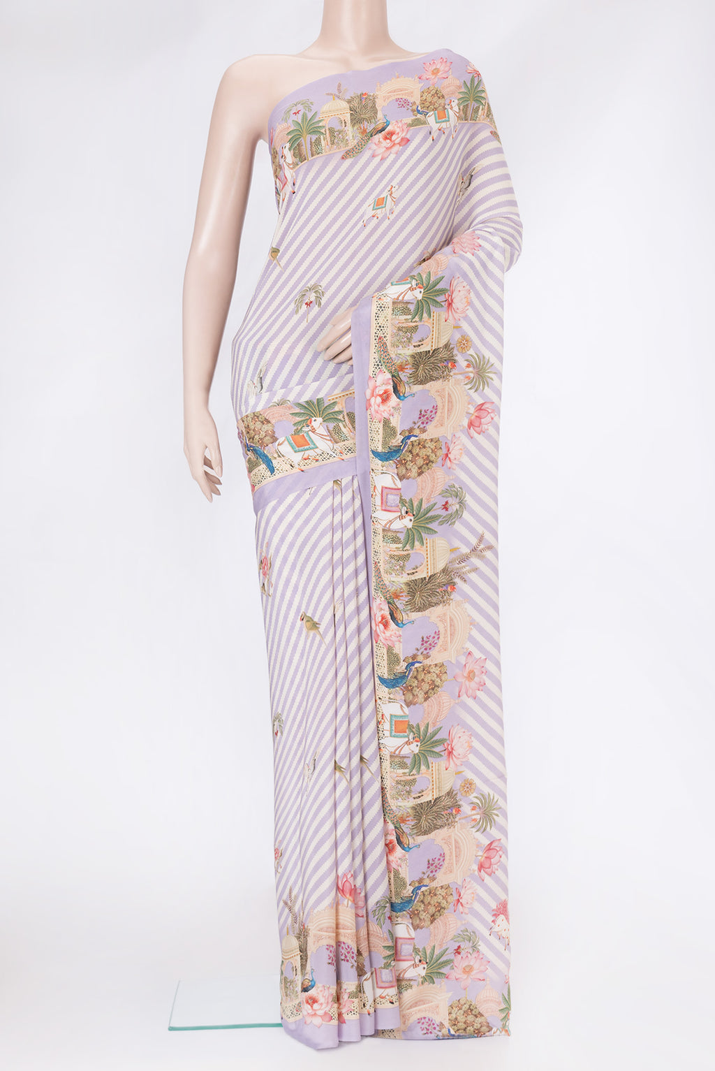 Lavender Mysore Crepe Saree with Printed design on the body and Plain Border.  displayed on a mannequin