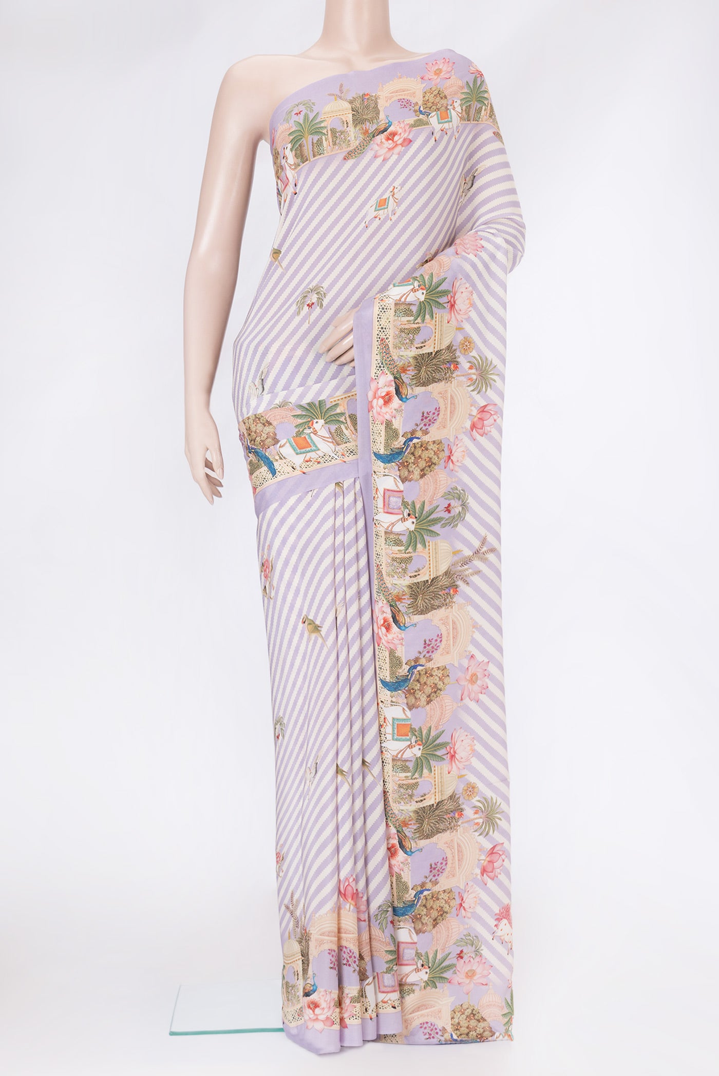 Lavender Mysore Crepe Saree with Printed design on the body and Plain Border.  displayed on a mannequin