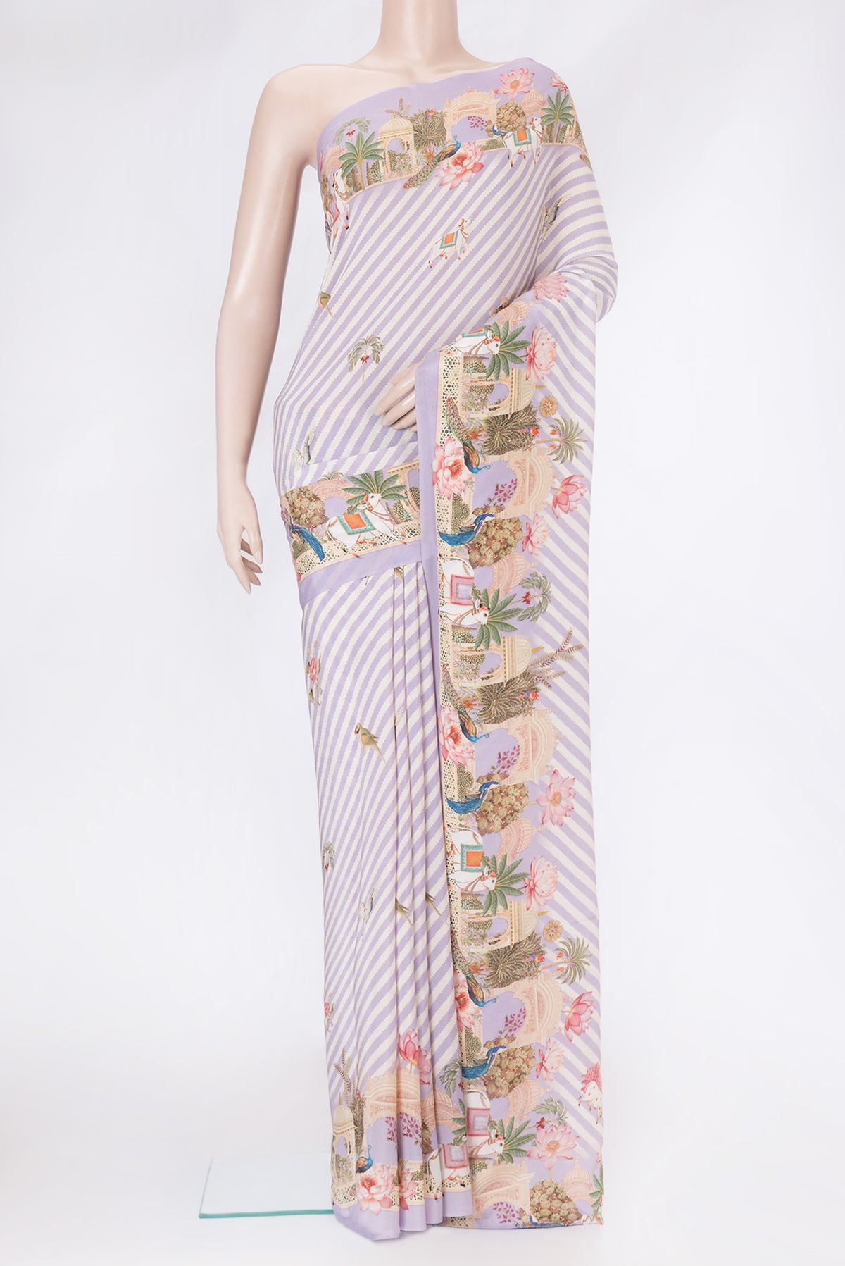 Lavender Mysore Crepe Saree with Printed design on the body and Plain Border.  displayed on a mannequin
