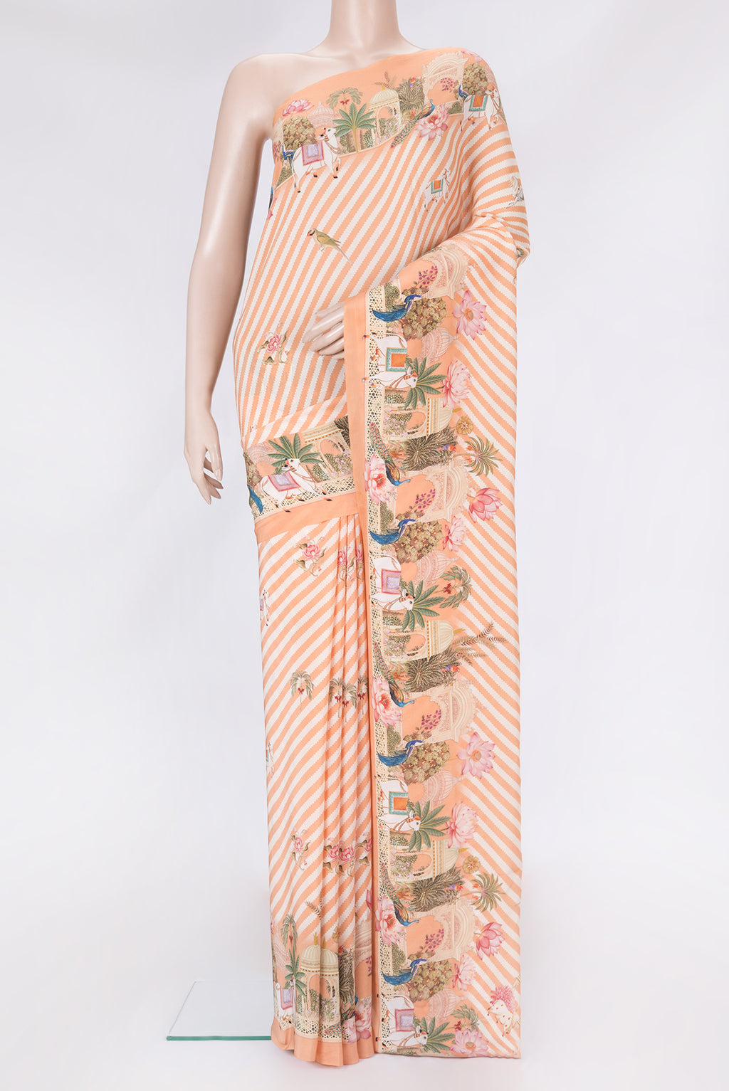 Orange Dual Tone Mysore Crepe Saree with Printed design on the body and Fancy Border.  displayed on a mannequin