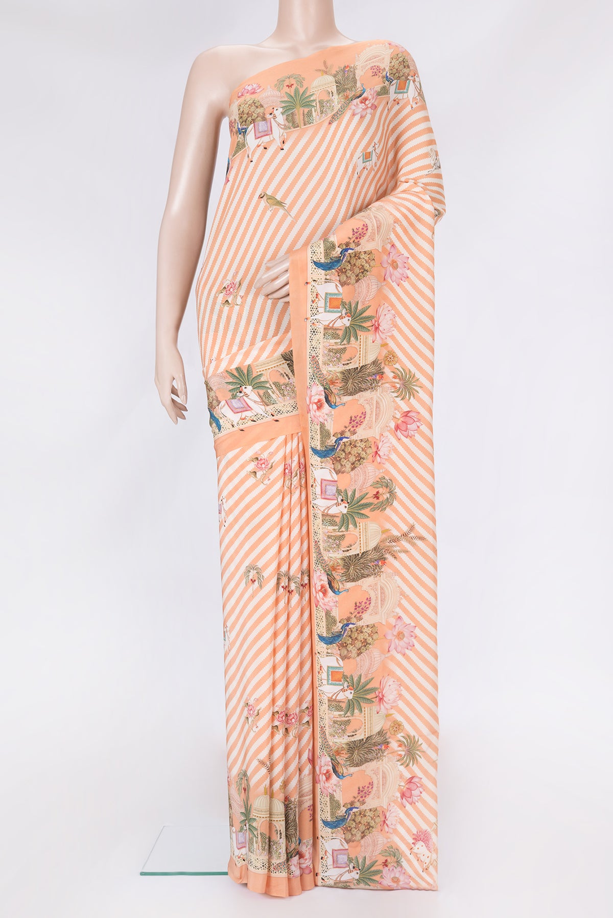 Orange Dual Tone Mysore Crepe Saree with Printed design on the body and Fancy Border.  displayed on a mannequin