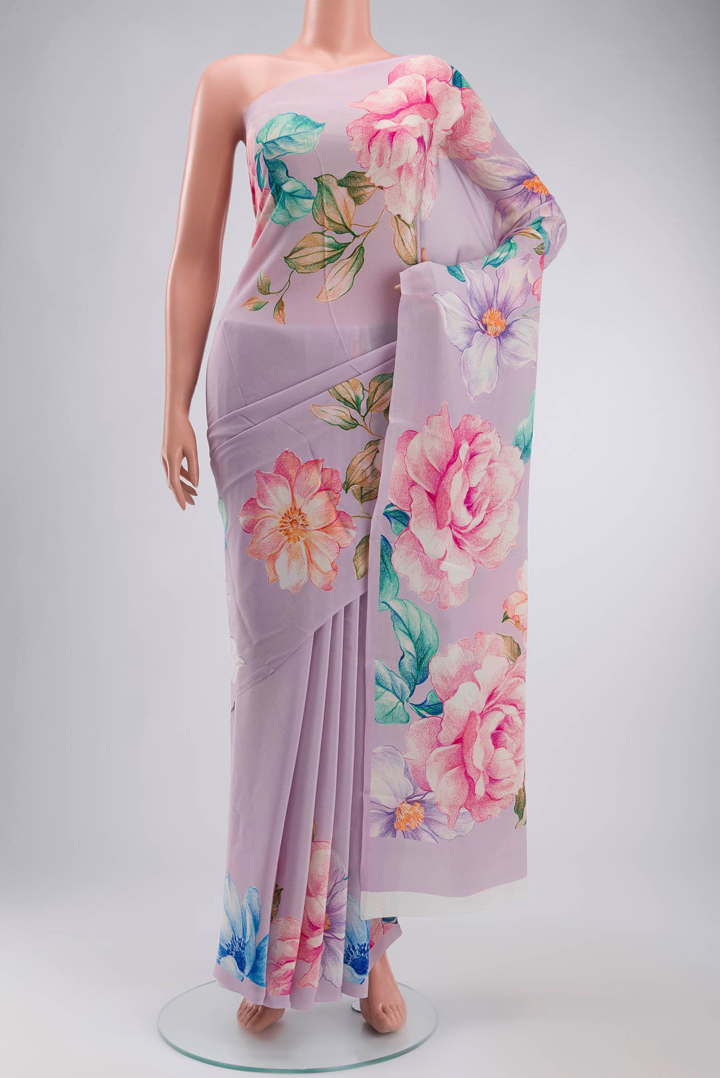 Lavender Mysore Crepe Saree with Printed design on the body and Printed Border displayed on a mannequin