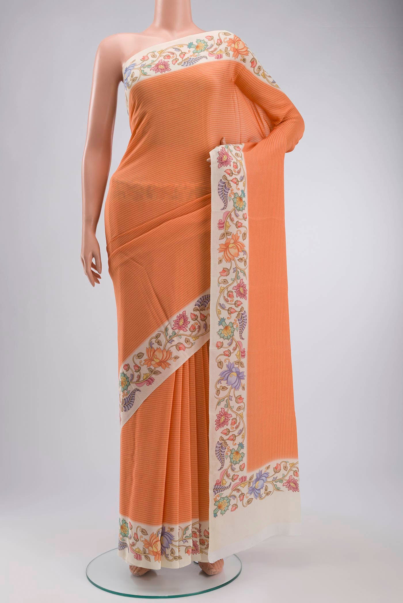 Orange Mysore Crepe Saree with Stripes on the body and Printed Border displayed on a mannequin