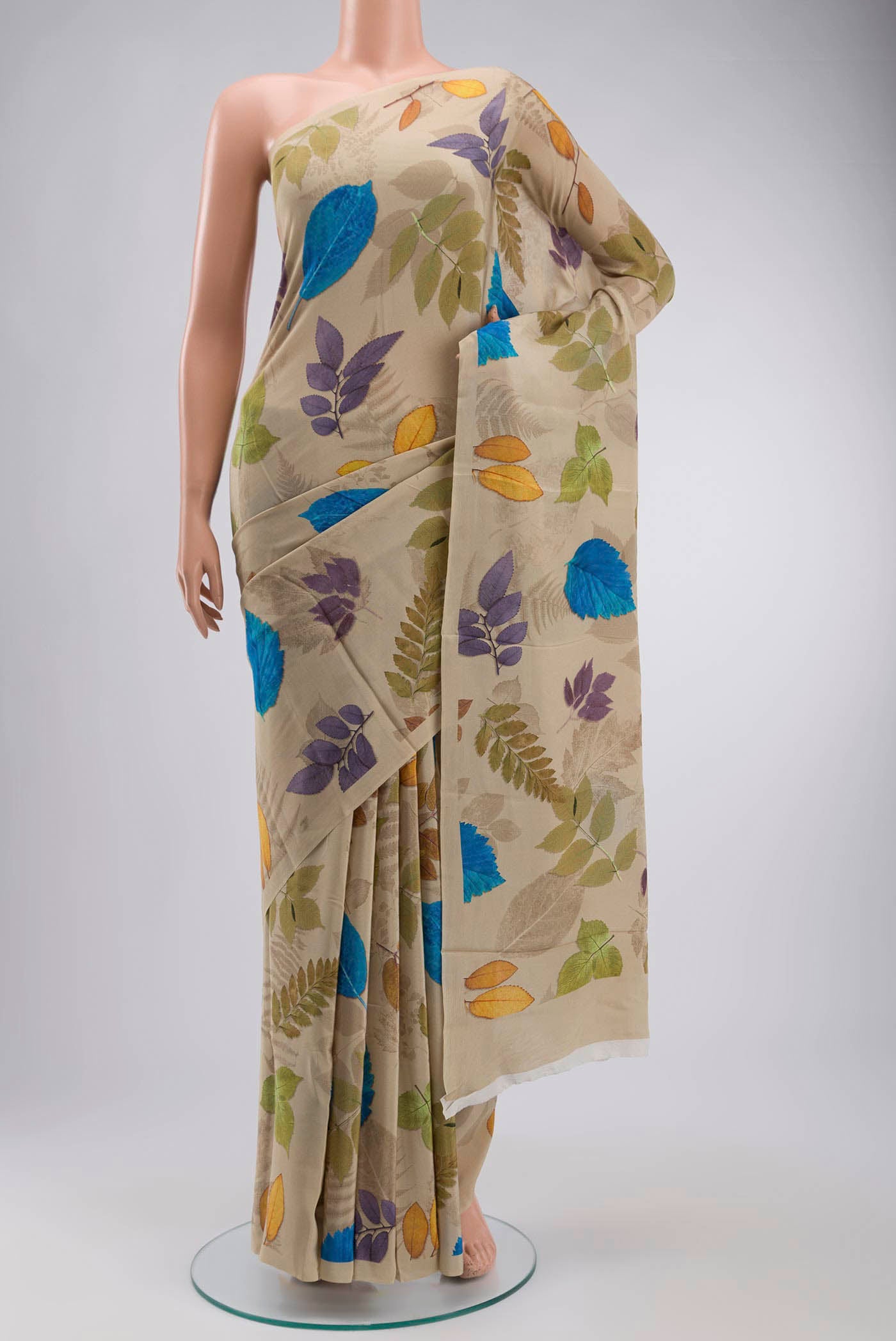 Beige Mysore Crepe Saree with Printed design on the body and Plain Border displayed on a mannequin