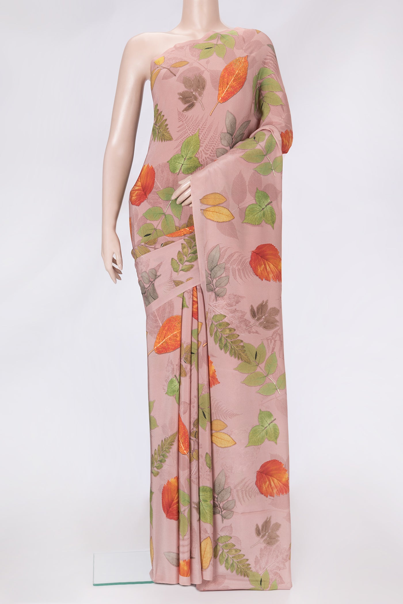 Rose Gold Dual Tone Mysore Crepe Saree with Printed design on the body and Without Border.  displayed on a mannequin
