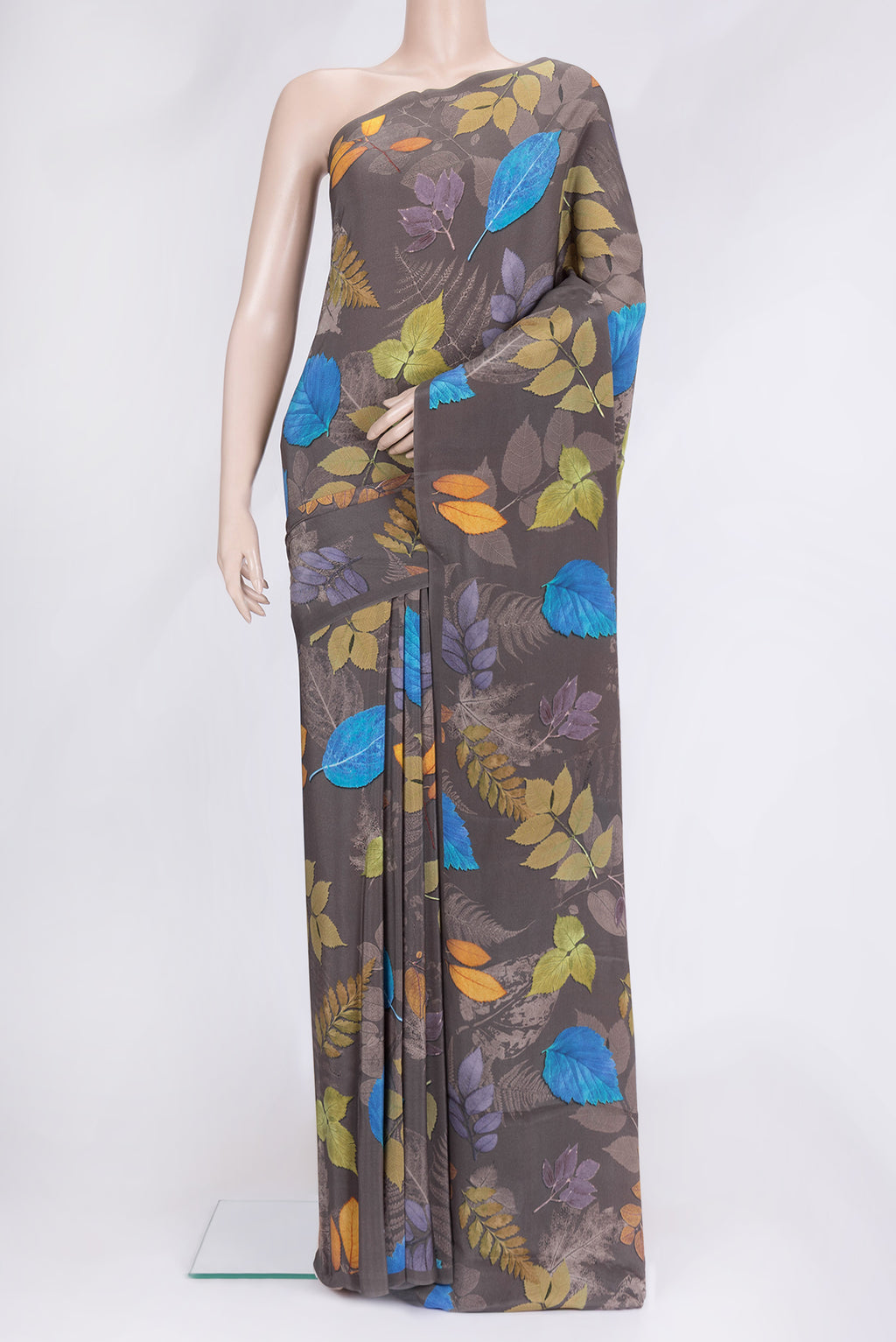 Grey Dual Tone Mysore Crepe Saree with Printed design on the body and Without Border.  displayed on a mannequin