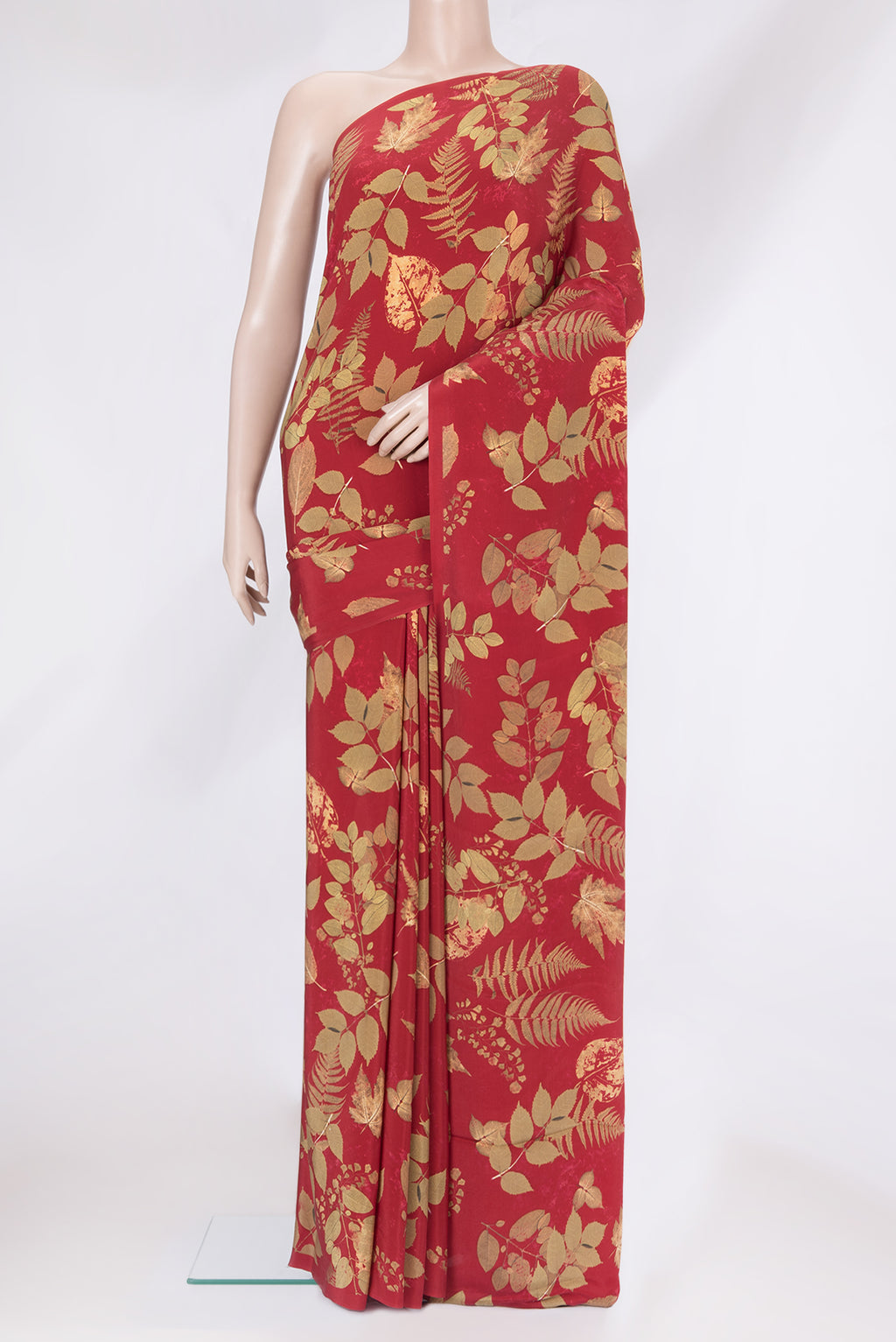 Maroon Crepe Saree with Printed design on the body and Without Border.  displayed on a mannequin