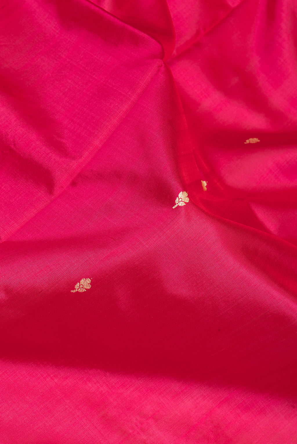 Close up of Pink Banarasi Silk Saree with Thread Butta on the body and Thread Border.  displaying folds