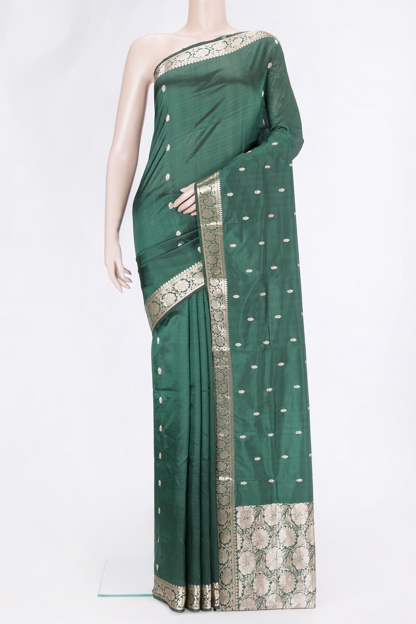 Bottle Green Dual Tone Banarasi Silk Saree with Zari Butta on the body and Zari Border.  displayed on a mannequin