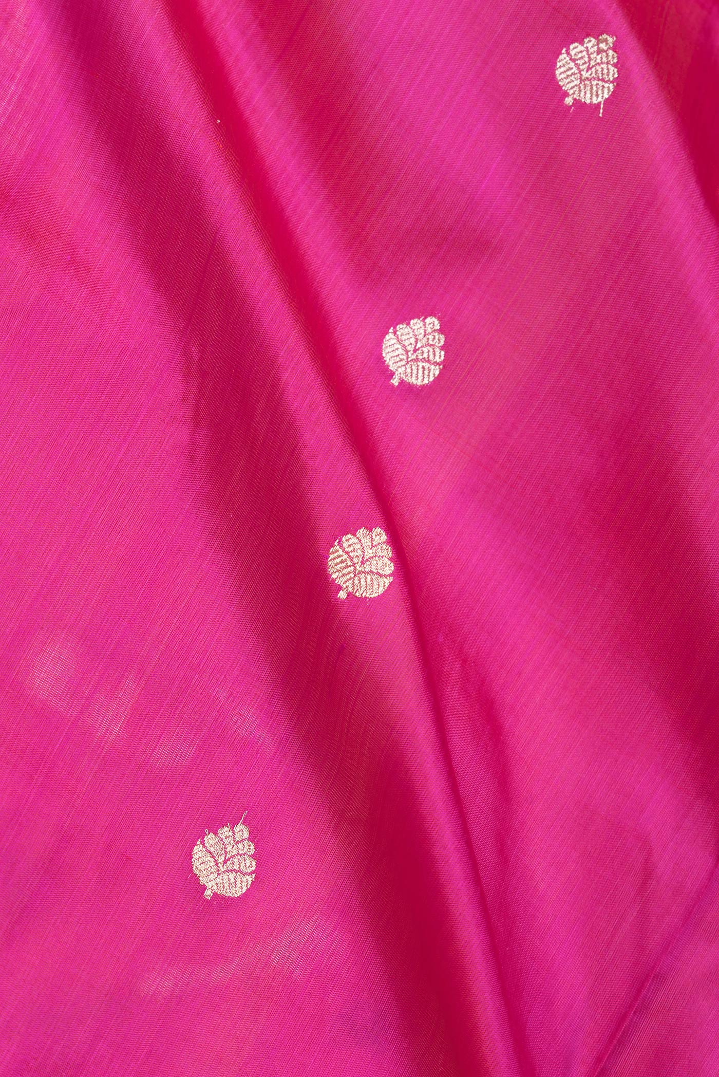 Close up of Pink Dual Tone Banarasi Silk Saree with Zari Butta on the body and Zari Border.  displaying folds