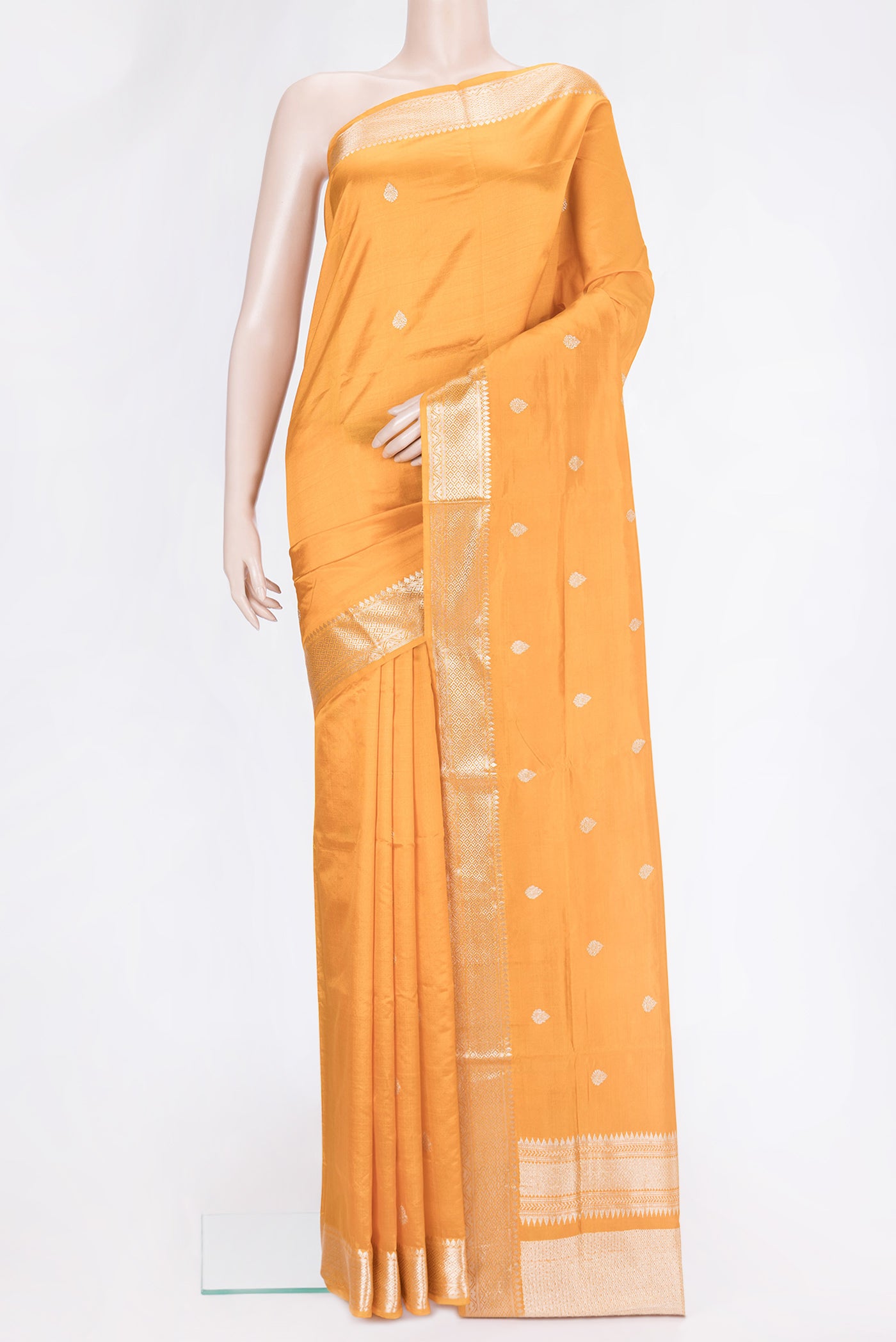 Mustard Dual Tone Banarasi Silk Saree with Zari Butta on the body and Zari Border.  displayed on a mannequin