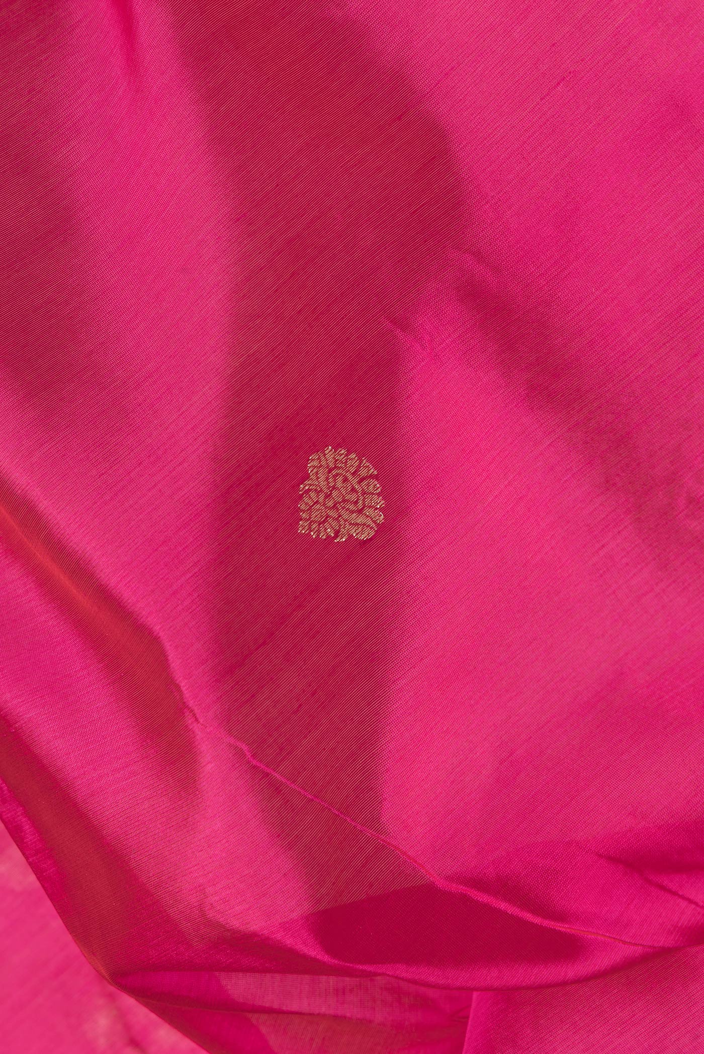 Close up of Pink Dual Tone Banarasi Silk Saree with Zari Butta on the body and Zari Border.  displaying folds