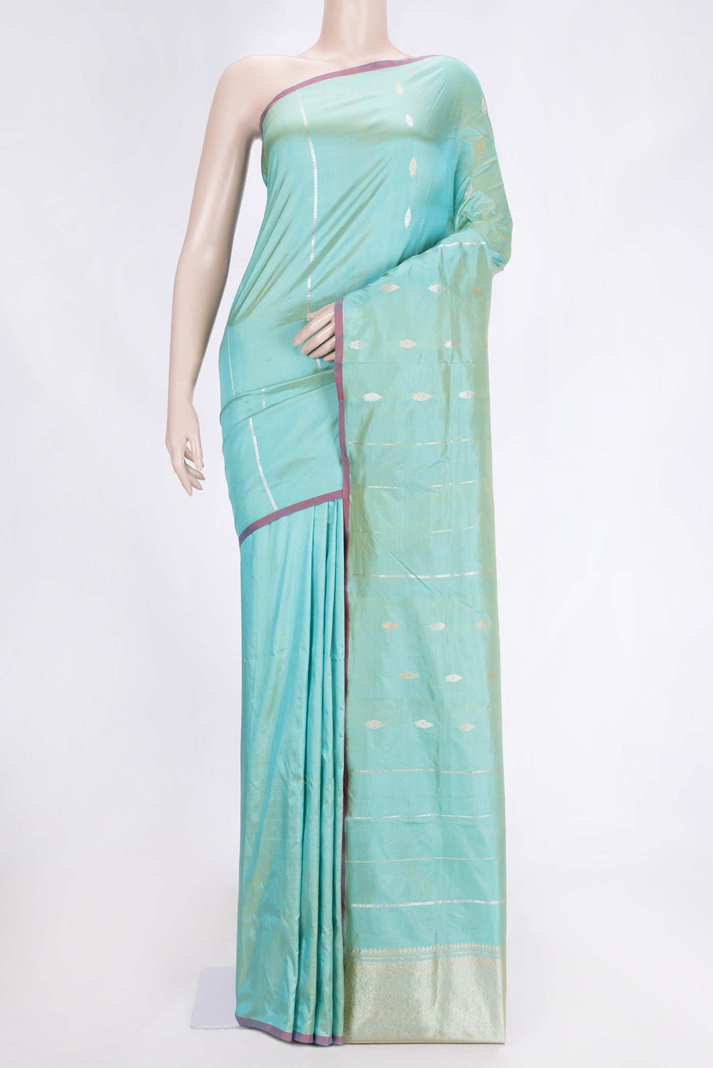 Pista Green Dual Tone Banarasi Silk Saree with Zari Butta on the body and Thread Border.  displayed on a mannequin