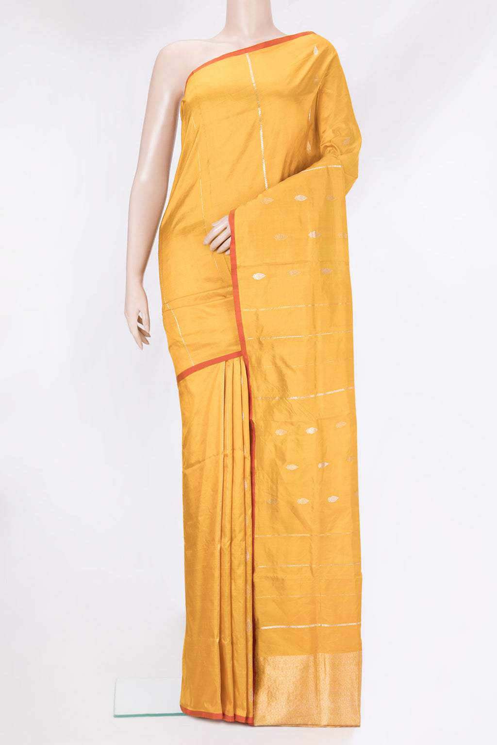 Mustard Banarasi Katan Silk Saree with Zari Butta on the body and Without Border.  displayed on a mannequin