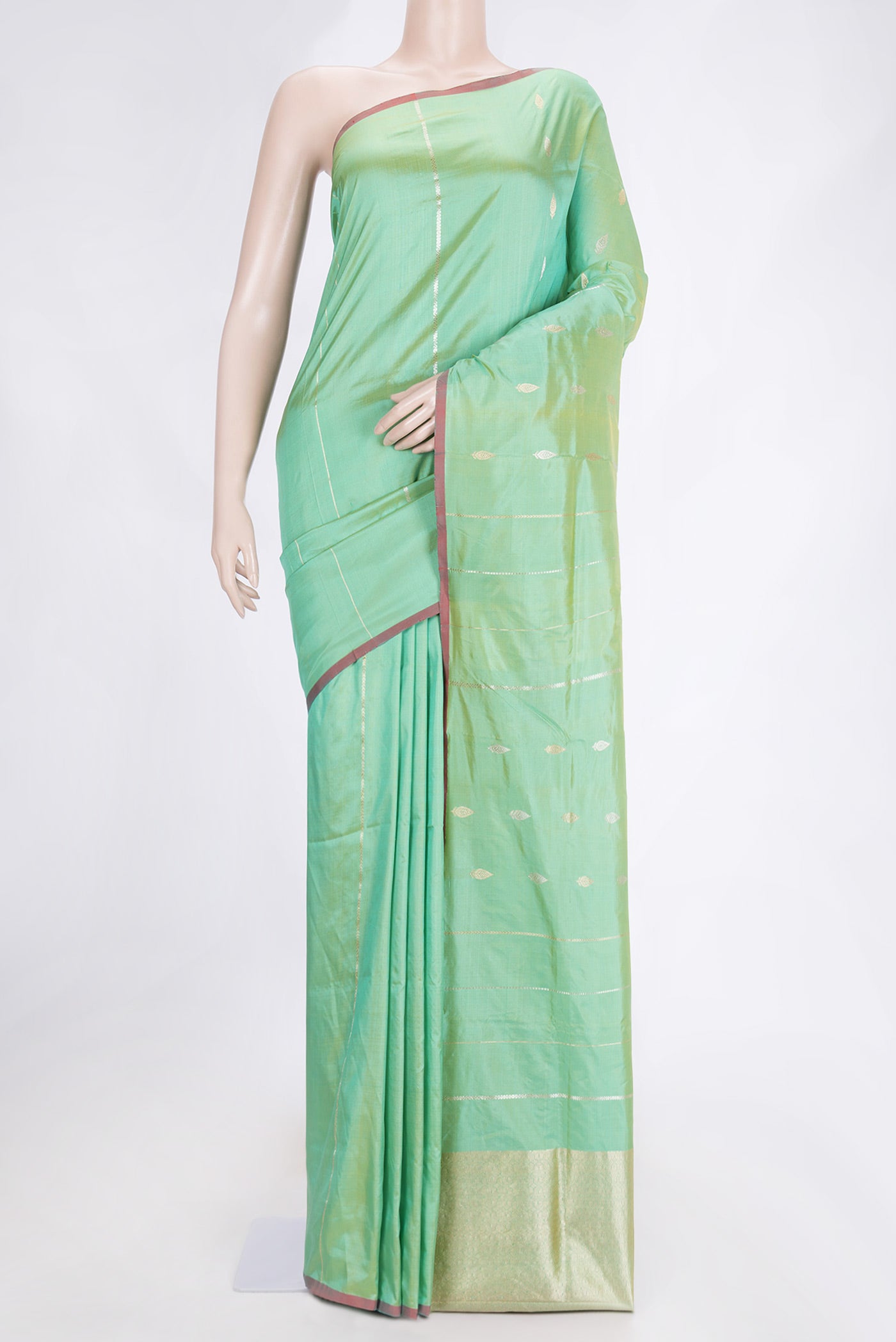 Green Dual Tone Banarasi Silk Saree with Zari Butta on the body and Thread Border.  displayed on a mannequin