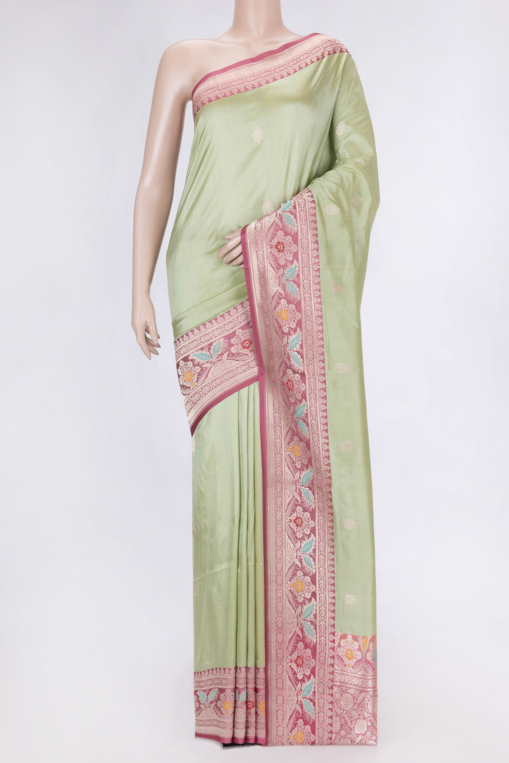 Pista Green Dual Tone Banarasi Silk Saree with Zari Butta on the body and Fancy Border.  displayed on a mannequin