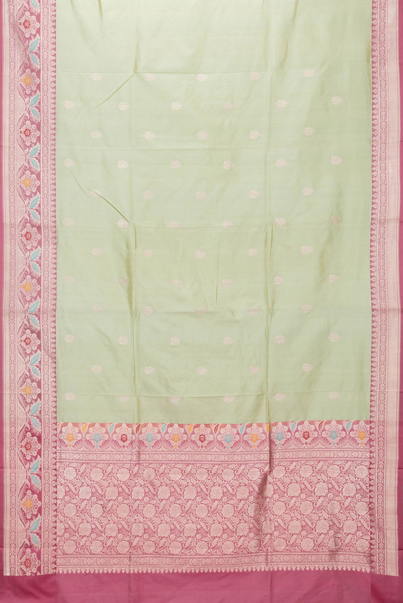 Flat view of Pista Green Dual Tone Banarasi Silk Saree with Zari Butta on the body and Fancy Border. 