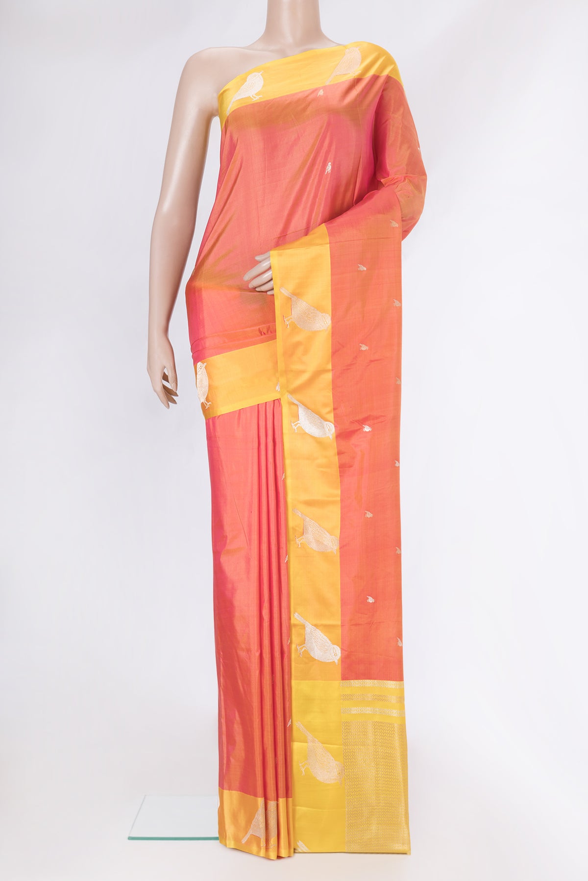Coral Dual Tone Banarasi Silk Saree with Zari Butta on the body and Zari Border.  displayed on a mannequin