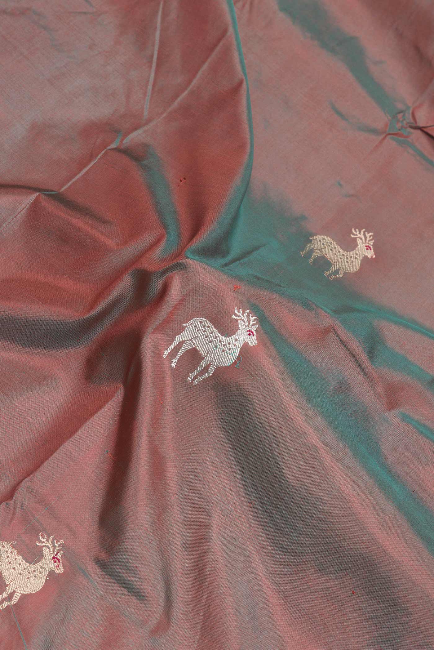 Close up of Brown Dual Tone Banarasi Silk Saree with Zari Butta on the body and Fancy Border.  displaying folds