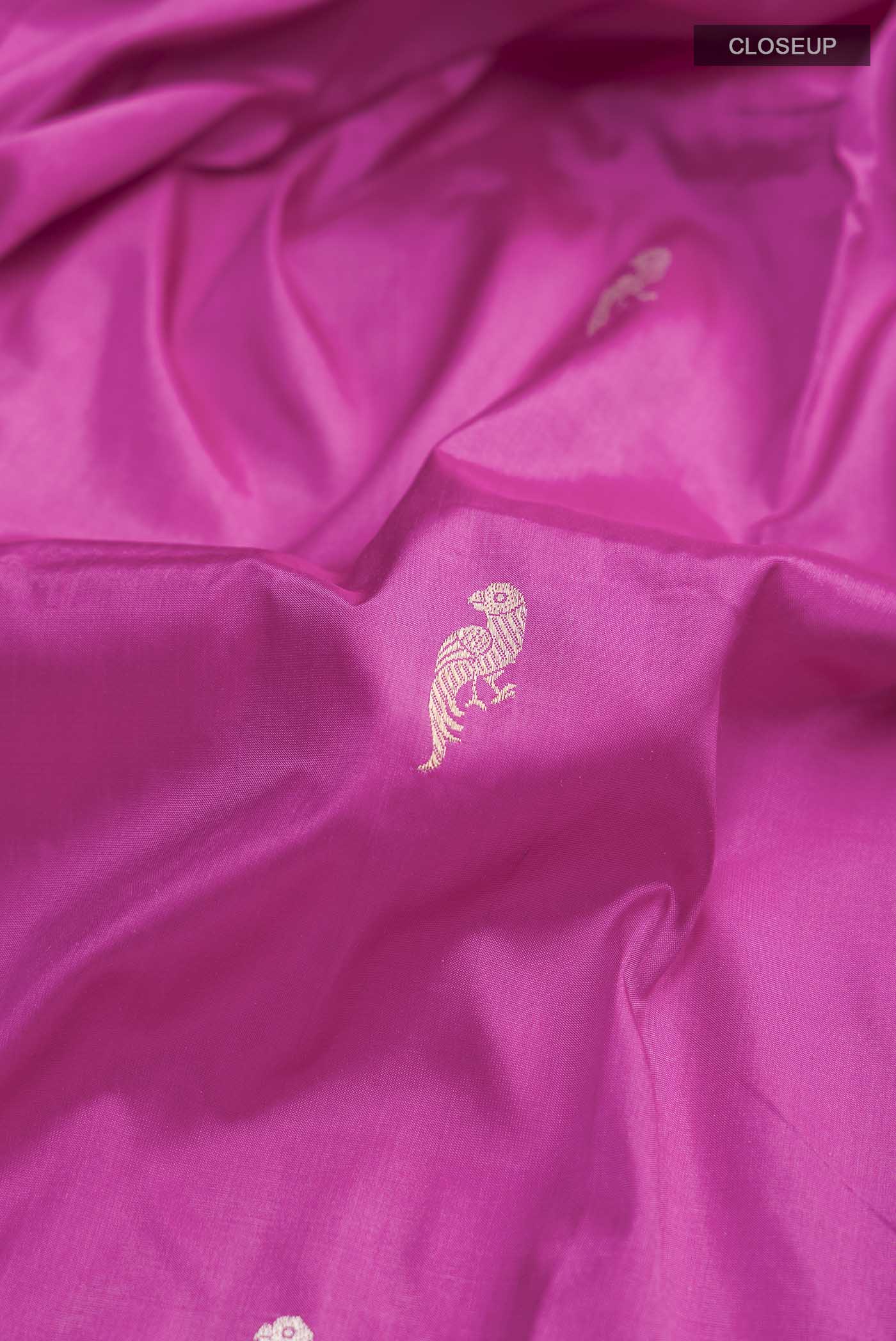 Close up of Light Magenta Banarasi Katan Silk Saree with Zari Butta on the body and Satin Border displaying folds