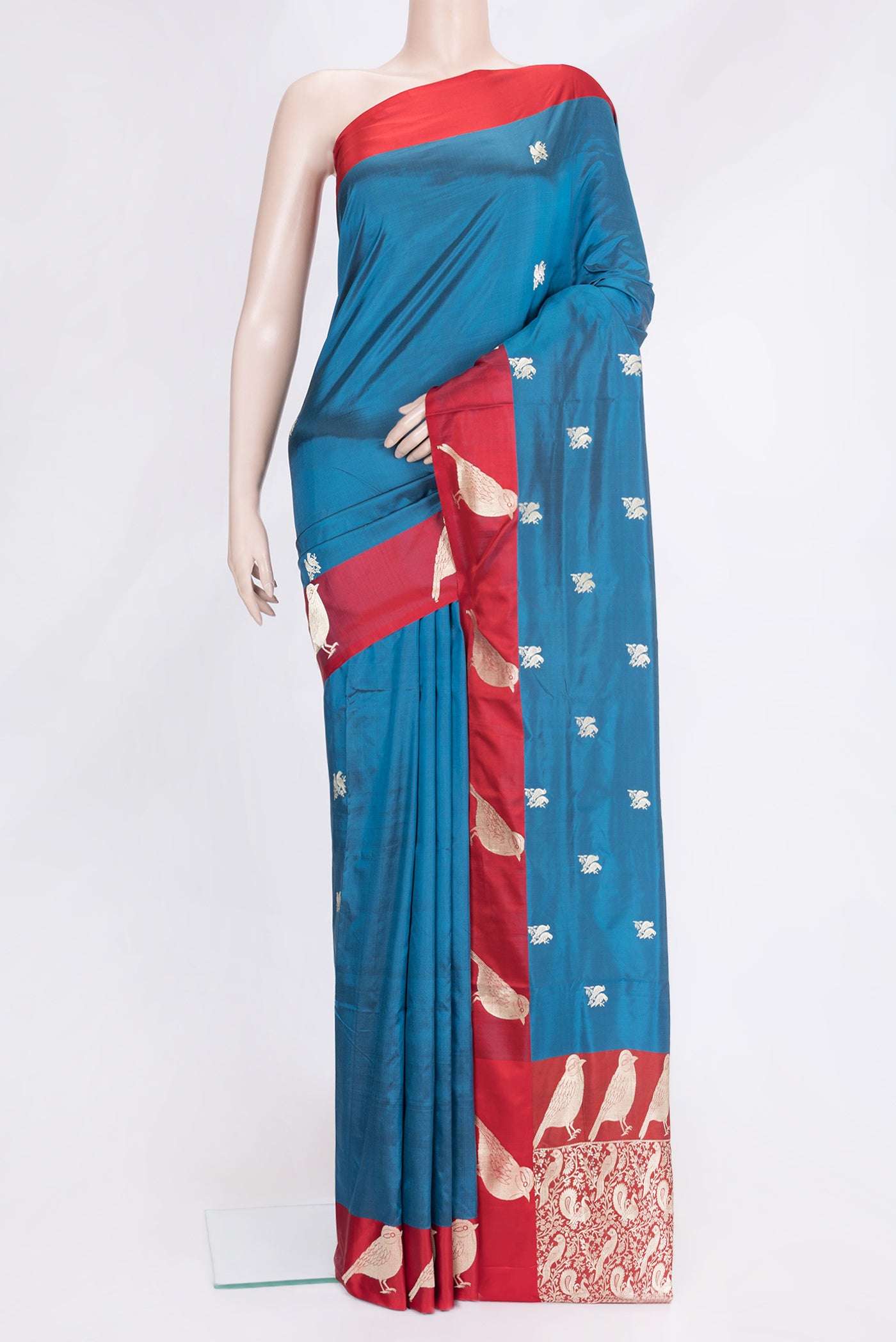 Peacock Blue Dual Tone Banarasi Silk Saree with Zari Butta on the body and Fancy Border.  displayed on a mannequin