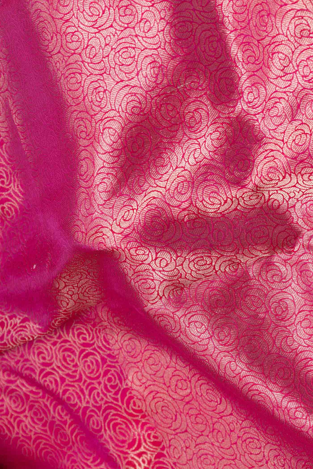 Close up of Pink Dual Tone Banarasi Saree with Zari Brocade on the body and Zari Border displaying folds