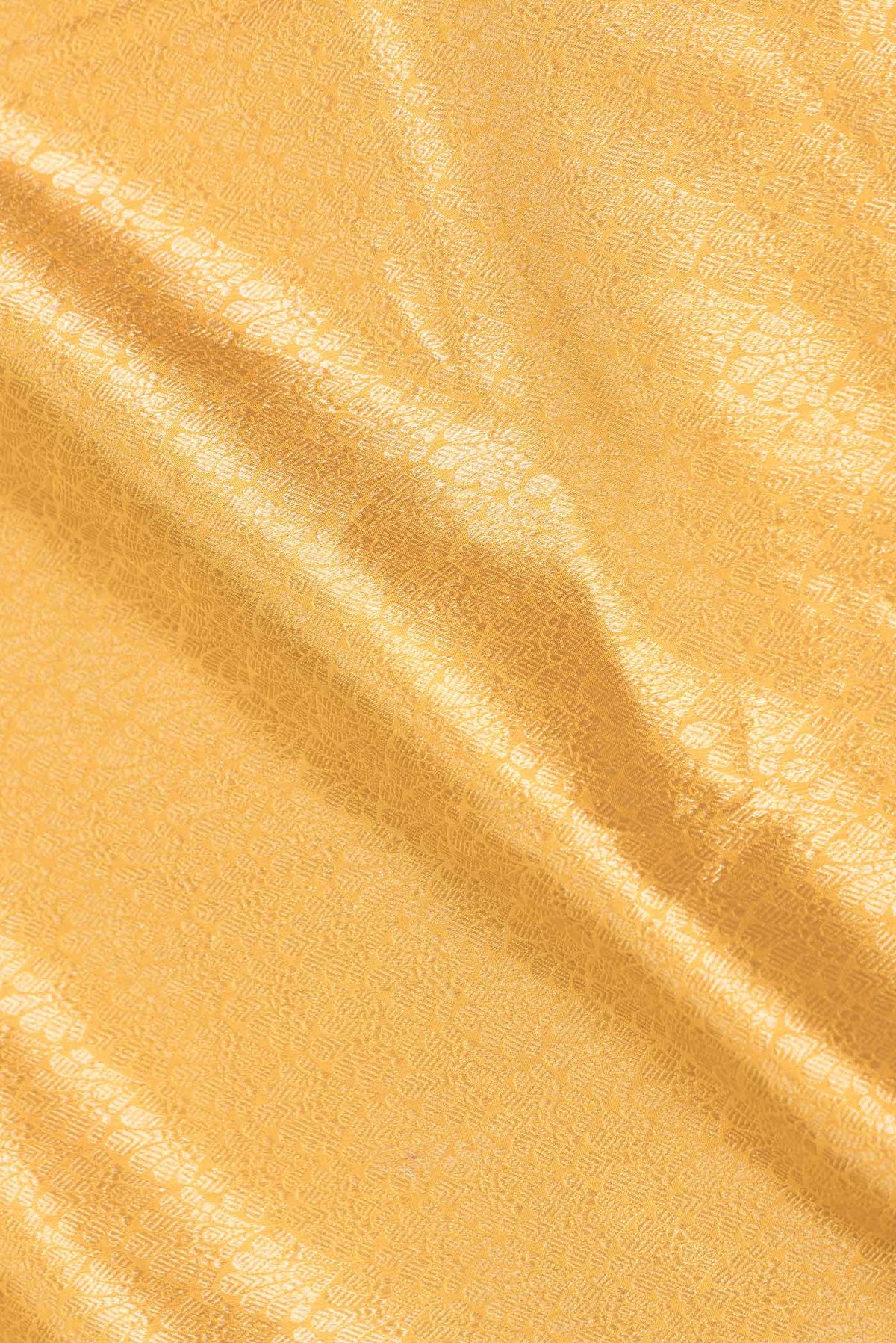 Close up of Yellow Dual Tone Banarasi Silk Saree with Zari Brocade on the body and Zari Border displaying folds