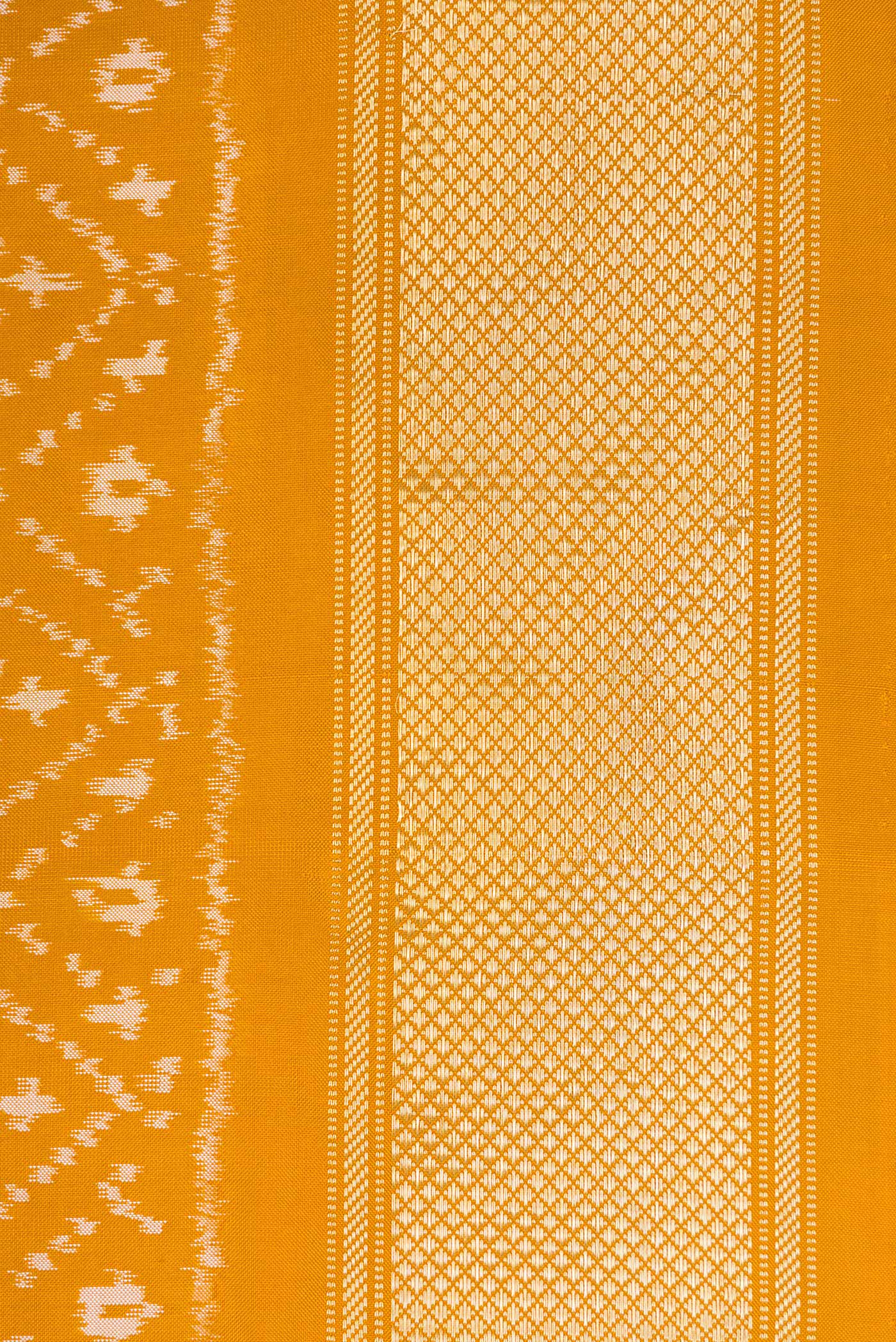 Border image of Mustard Dual Tone Double Ikat Nine Yards Saree with Ikat Print on the body and Zari Border. 