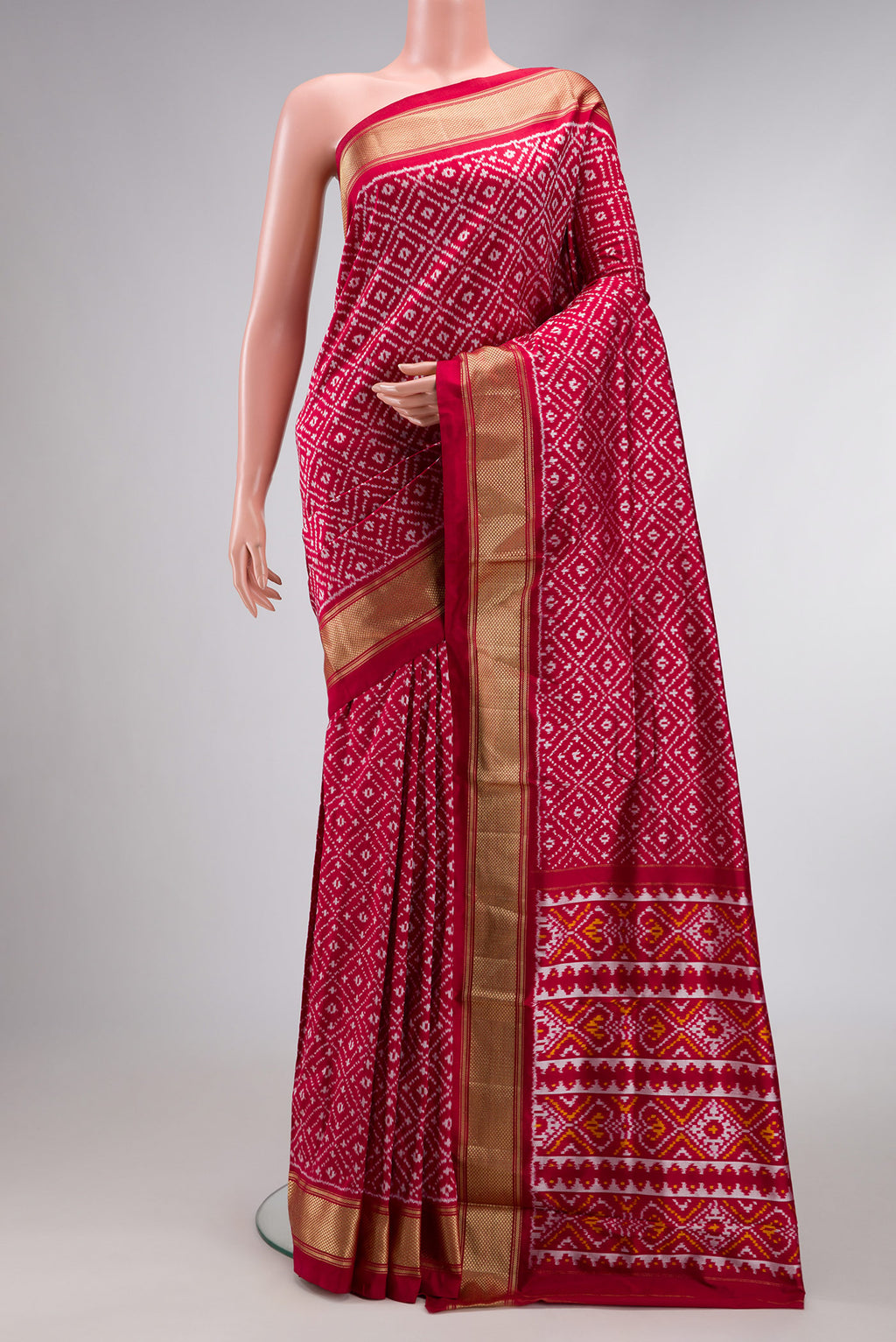 Maroon Dual Tone Double Ikat Nine Yards Saree with Ikat Print on the body and Zari Border.  displayed on a mannequin