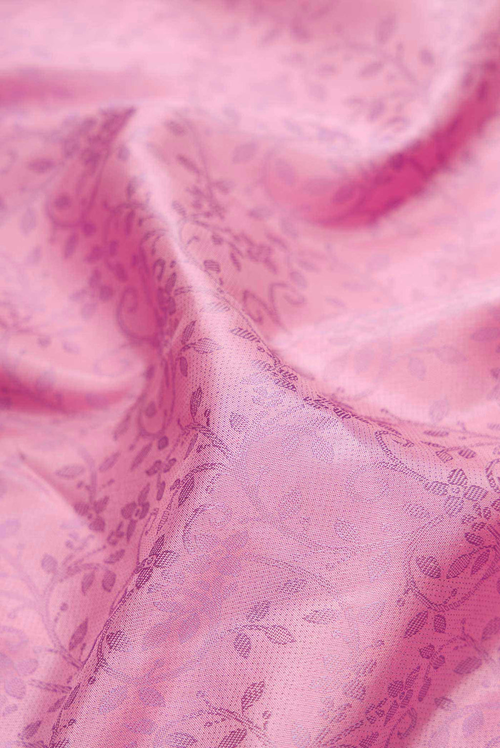Close up of Pure Silk Pure Zari Pink Dual Tone Kanchipuram Saree with Jacquard design on the body and Fancy Border displaying folds