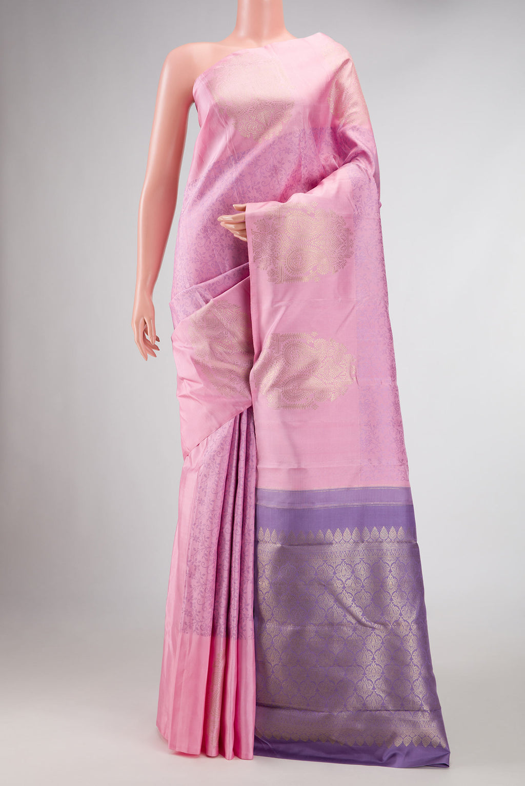 Pure Silk Pure Zari Pink Dual Tone Kanchipuram Saree with Jacquard design on the body and Fancy Border displayed on a mannequin