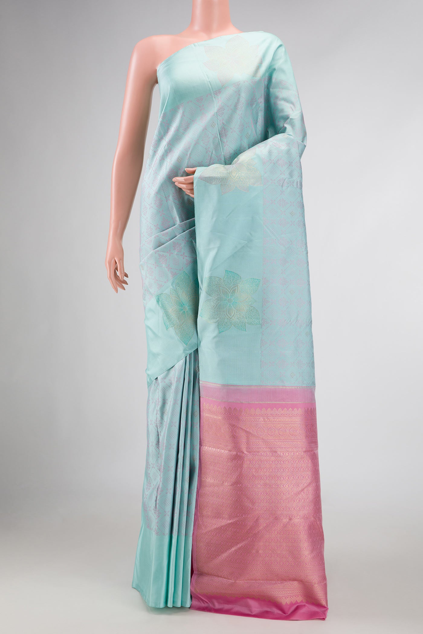 Pure Silk Pure Zari Light Blue Dual Tone Kanchipuram Saree with Jacquard design on the body and Fancy Border displayed on a mannequin