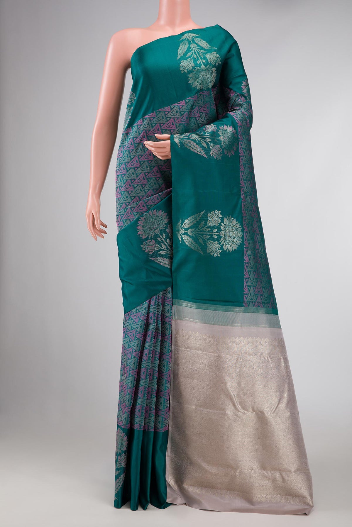 Bottle Green Dual Tone Kanchipuram Silk Saree with Jacquard design on the body and Fancy Border displayed on a mannequin