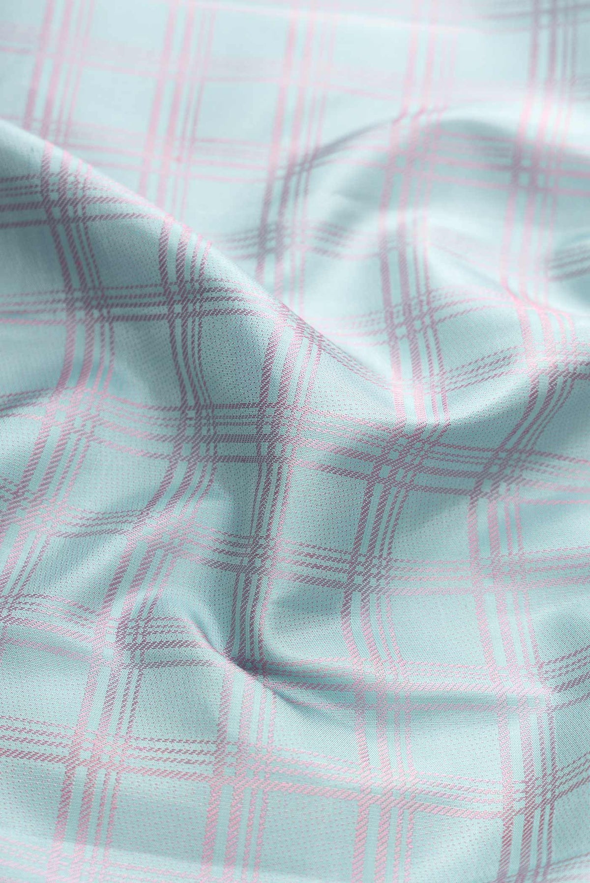 Close up of Sky Blue Dual Tone Kanchipuram Silk Saree with Checked design on the body and Fancy Border displaying folds