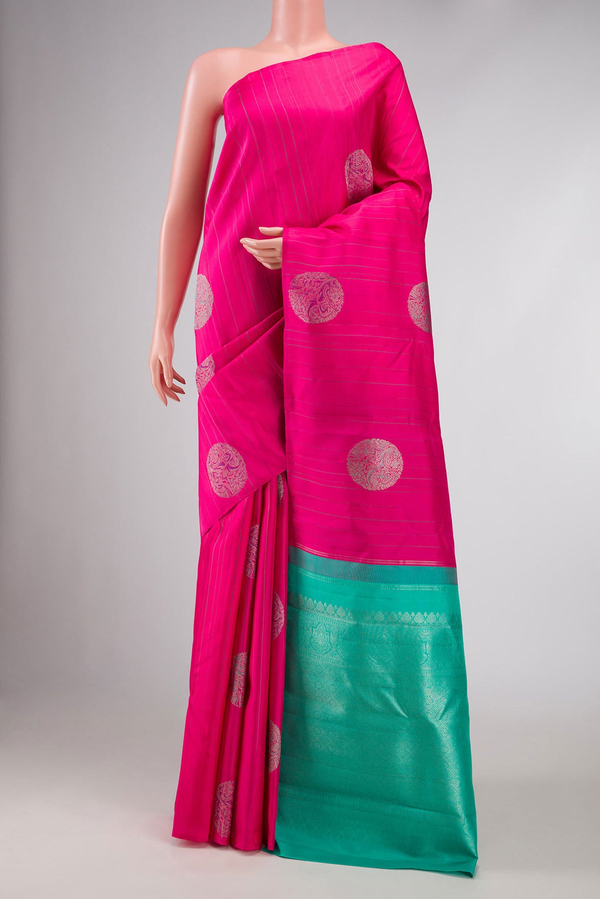 Dark Pink Dual Tone Kanchipuram Silk Saree with Zari And Thread Butta on the body and Without Border displayed on a mannequin