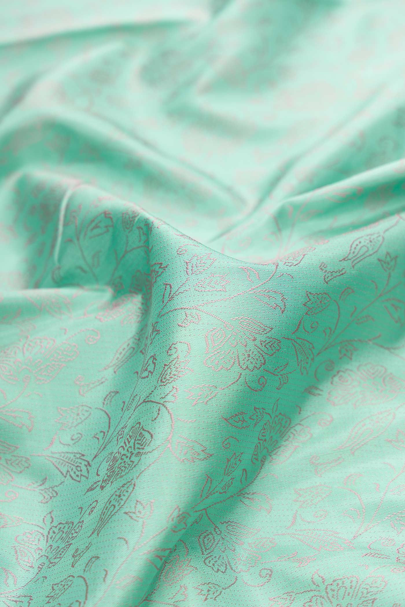 Close up of Pure Silk Pure Zari Sea Green Dual Tone Kanchipuram Saree with Jacquard design on the body and Fancy Border displaying folds