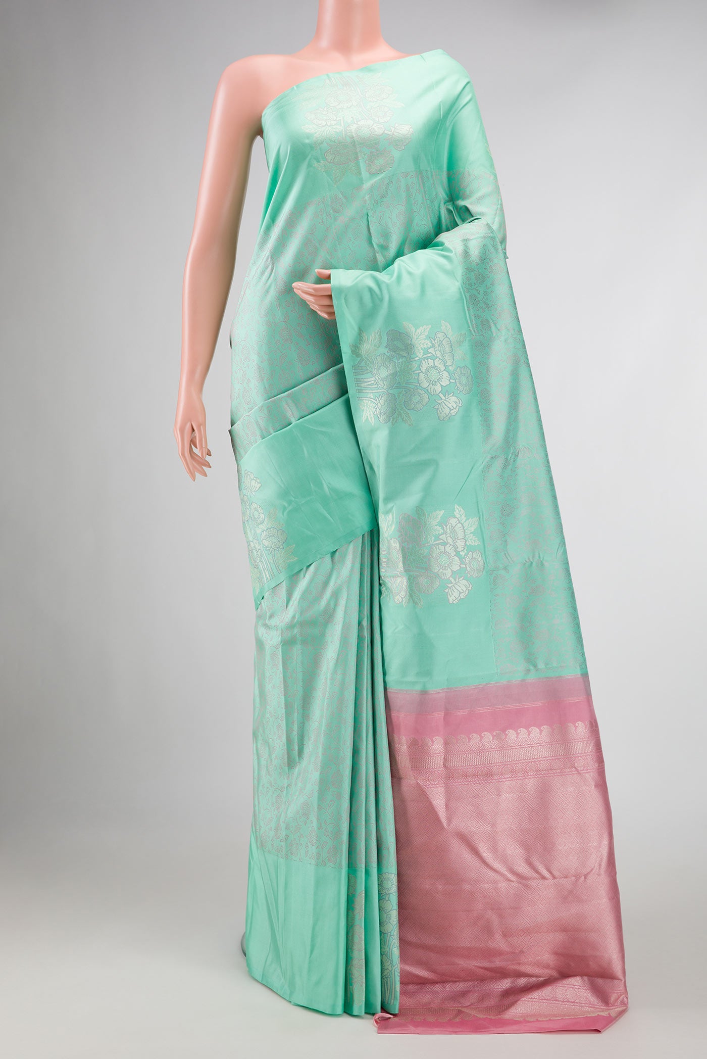 Pure Silk Pure Zari Sea Green Dual Tone Kanchipuram Saree with Jacquard design on the body and Fancy Border displayed on a mannequin