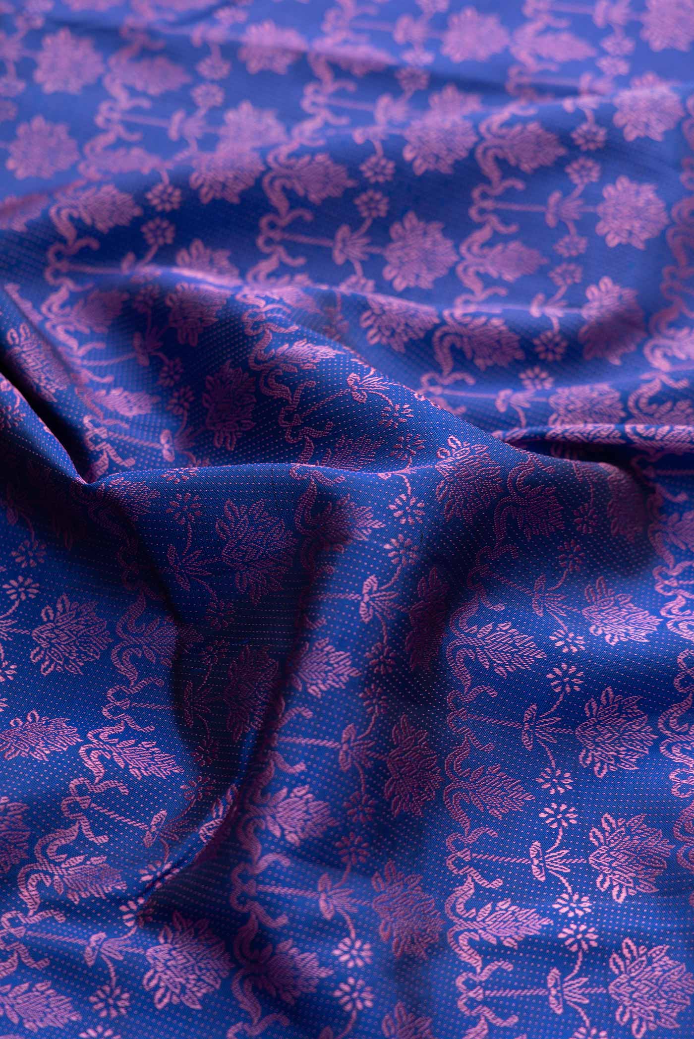 Close up of Pure Silk Pure Zari Royal Blue Dual Tone Kanchipuram Saree with Jacquard design on the body and Fancy Border displaying folds