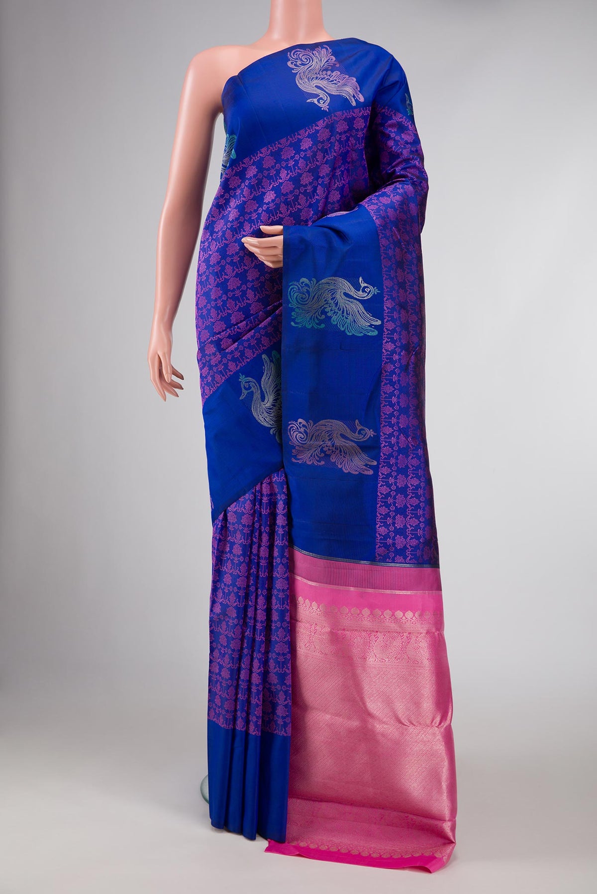 Pure Silk Pure Zari Royal Blue Dual Tone Kanchipuram Saree with Jacquard design on the body and Fancy Border displayed on a mannequin