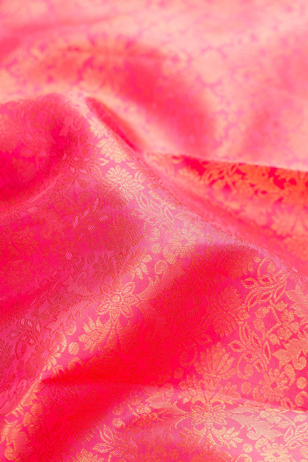 Close up of Pink Dual Tone Kanchipuram Silk Saree with Zari Brocade on the body and Zari Border.  displaying folds