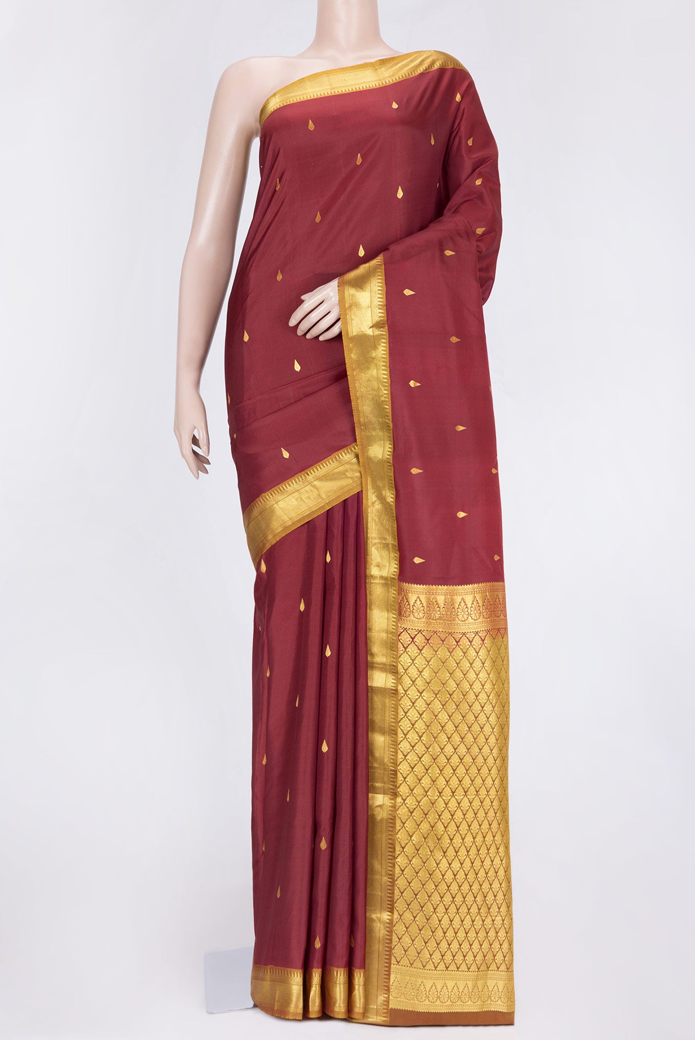 Maroon Dual Tone Kanjivaram Saree with Zari Butta on the body and Zari Border.  displayed on a mannequin