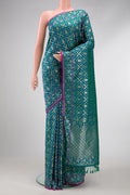 Peacock Blue Dual Tone Blended Banarasi Silk Saree with Zari Brocade on the body and Zari Border.  displayed on a mannequin